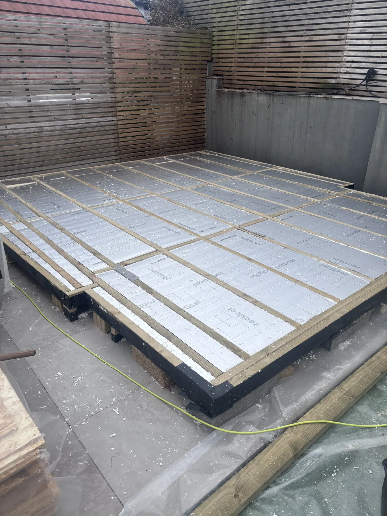 Arden & Oak garden room build — PIR insulation between joists